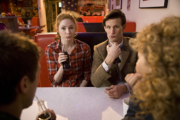 unit still photo of Amy and The Doctor drinking through strawers
