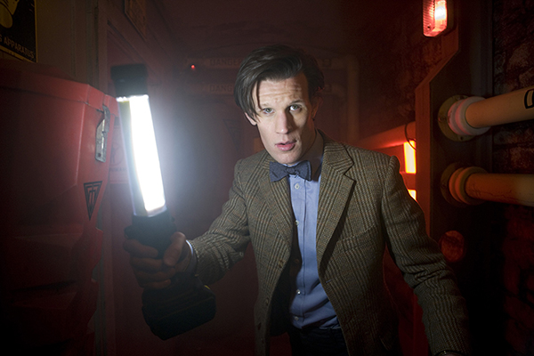 film still photo of The Doctor in a corridor with a lamp