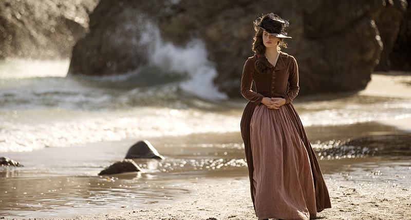 Elizabeth (Heida Reed) walking on beach alone